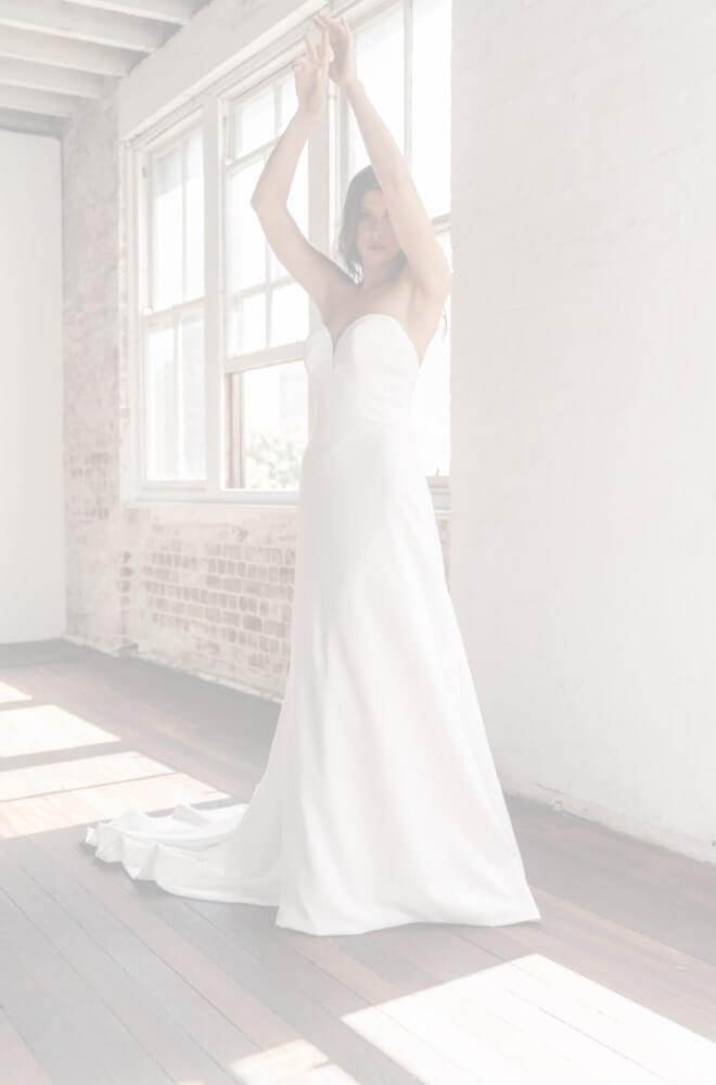 Model wearing a white dress
