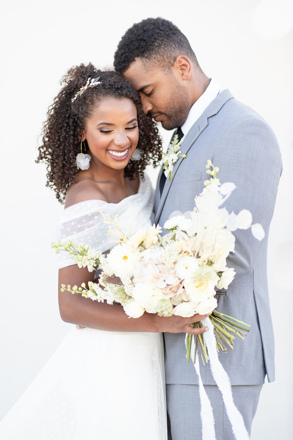 Myron &amp; Olivia wearing Renee Grace Bridal
